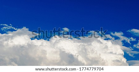 Summer blue sky covered with white clouds