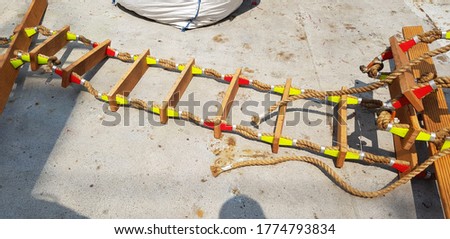 picture of a marine ladder used to usually embark on board boats while they are at sea,also called pilot ladder 