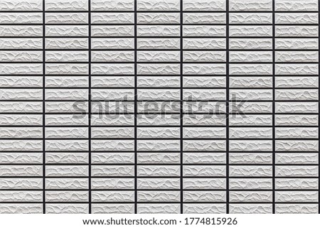 Modern pattern of white stone block wall tile texture and seamless background