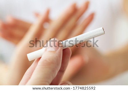 Stop smoking, close up of woman breaking cigarette