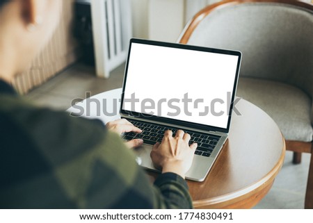 computer mockup image blank screen.hand woman work using laptop with white background for advertising,contact business search information on desk at coffee shop.marketing and creative design