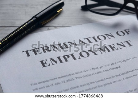 Selective focus of pen,glasses and Termination of Employee letter on a white wooden background. Royalty-Free Stock Photo #1774868468