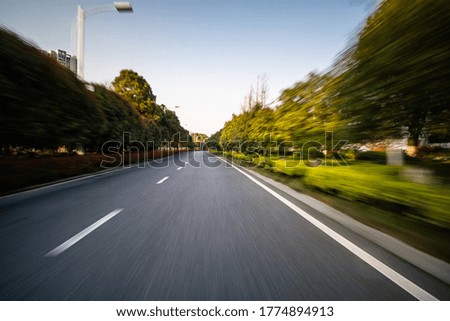 empty asphalt road with city skyline in hangzhou china