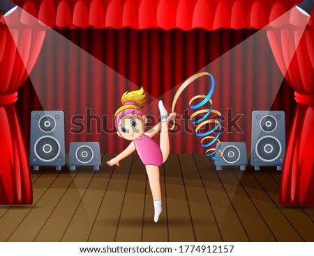 Cute little girl dancing on the stage