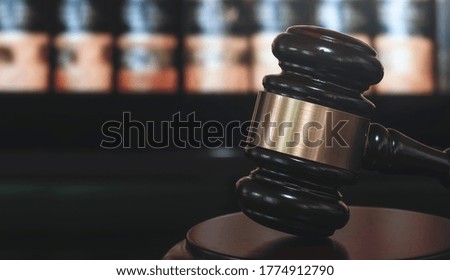 Judge gavel on black background, shoot in low light. Law concept.