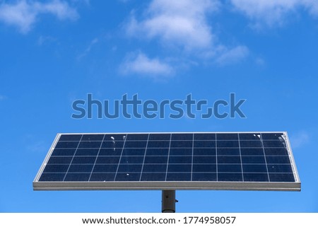Solar panel against blue sky copy space, renewable green energy source from photovoltaic module