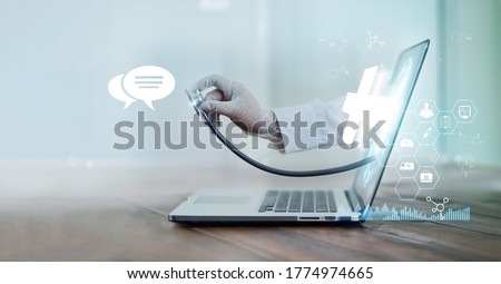 Virtual doctor concept, The doctor's hand with stethoscope protrudes from the laptop screen to examine the patient. Online consultation, Virtual hospital and online therapy. Royalty-Free Stock Photo #1774974665