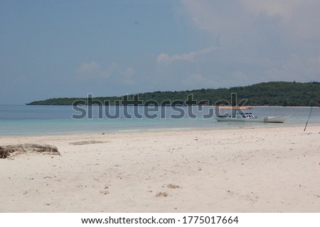 Landscape photography on Bira beach, boats seen on the seafront