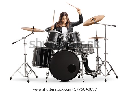 Young female drummer playing drums with drumsticks isolated on white background Royalty-Free Stock Photo #1775040899
