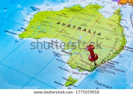 Push pin pointing to Canberra in Australia