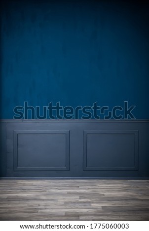 Dark vintage blue room, interior with gray laminate and wooden molding