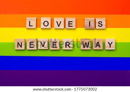 LGBT pride. Lesbian Gay Bisexual Transgender. LGBT, love is never way letters on the LGBT flag. The concept of rainbow love. Human rights and tolerance. Poster, postcard, banner and background.