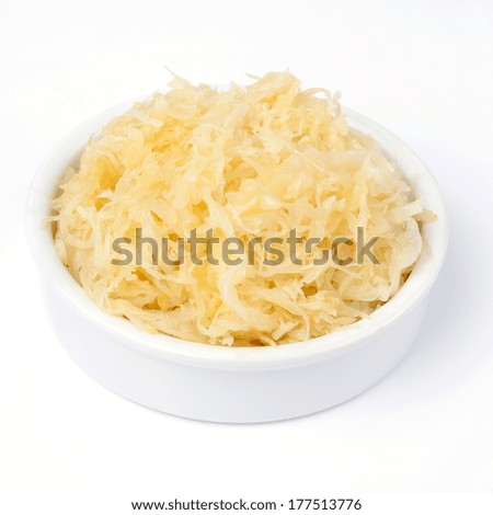 sauerkraut on plate isolated over white Royalty-Free Stock Photo #177513776