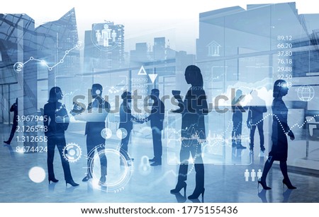 Silhouettes of business people working together in office with double exposure of blurry cityscape and HUD infographic interface. Concept of statistics and data analysis. Toned image