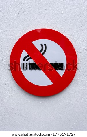 No Smoking Sign on a Concrete Wall