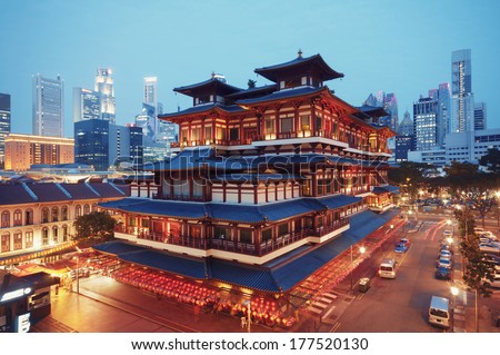 Buddha Toothe Relic Temple in Chinatown in Singapore, with Singapore`s business district in the background.  Royalty-Free Stock Photo #177520130