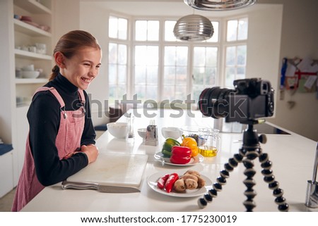 Young Girl Vlogger Making Social Media Video About Cooking For The Internet At Home