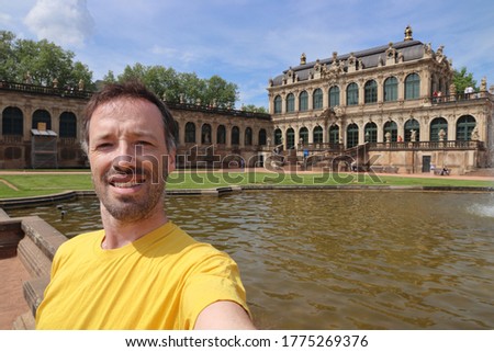 Tourist selfie with Zwinger Palace in Dresden, Germany. Euro trip traveler.