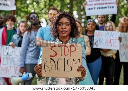 diverse american people took to the public park and streets to protest anti-black racism and police brutality. black lives matter, blm concept Royalty-Free Stock Photo #1775333045