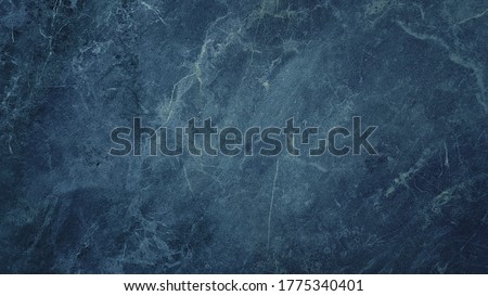 navy blue stone background with beautiful mineral veins. abstract elegance concept background with space for text.