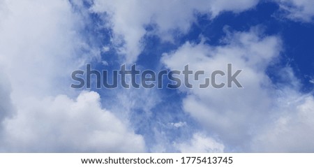 Panorama of the blue sky with white clouds (texture).