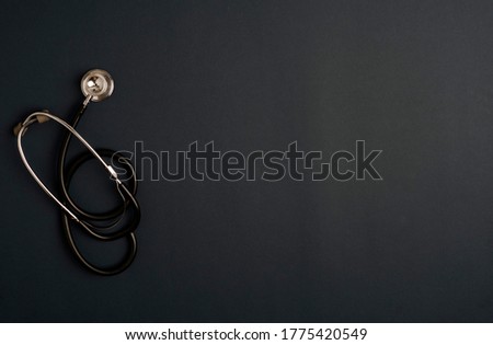 Covid-19 Coronavirus concept. stethoscope medicine accessories, black background with copy space. top view