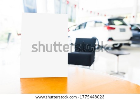 Mock up poster board stand on sales promotion advertisement sign white display on table in car show room, payment QR code signboard for customer deals announcement branding presentation marketing 