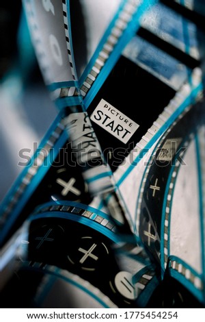 Cinema Film Strip Reel with blue details in a grey background. Hollywood, movie night. 