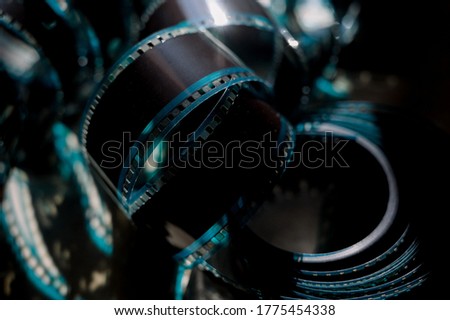 Cinema Film Strip Reel with blue details in a grey background. Hollywood, movie night. 