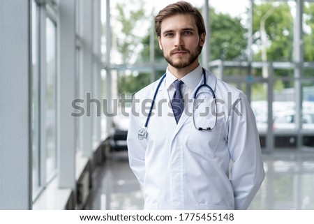 happy male medical doctor portrait in hospital
