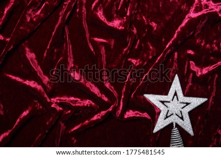 Christmas star on red velvet background