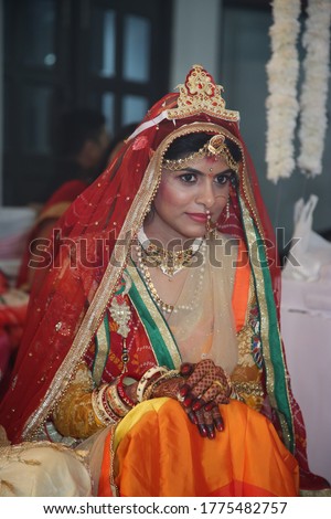Indian Bride during different ceremonies of haldi and reception wearing yellow saree and lehenga hand embroidered skirt respectively wearing jewellery and getting ready for marriage