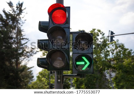 red german traffic light with green arrow light up allow by law to turn right Royalty-Free Stock Photo #1775553077