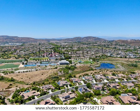Aerial view of Carmel Mountain neighborhood with big mansions and mountain on the background in San Diego, California, USA. 