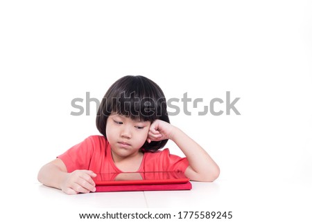 kid playing tablet on white background, child watching cartoon
