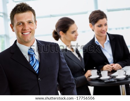 Happy successful business team working smiling at office.
