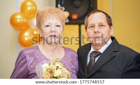 portrait two elderly aged persons in golden wedding annivesary married concept