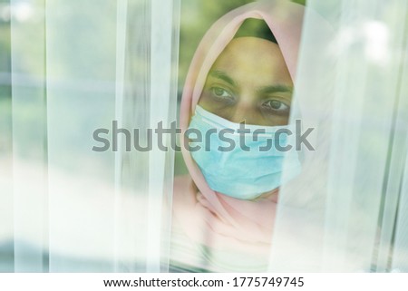 Arabic woman waiting in quarantine for Covid-19 to stop