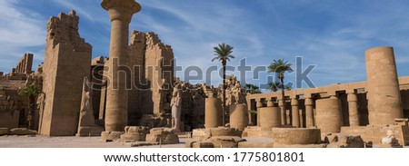 Karnak Temple, Colossal sculptures of ancient Egypt in the Nile Valley in Luxor, Embossed hieroglyphs on the wall.