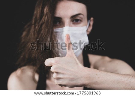 young model posing with coronavirus mask