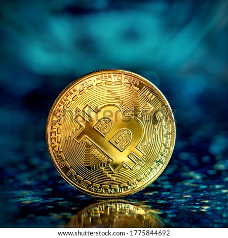 Photo Golden Bitcoins (new virtual money ) Close-up.
