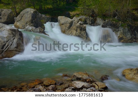 This is colorful waterfall in Caucasus mountains in summer