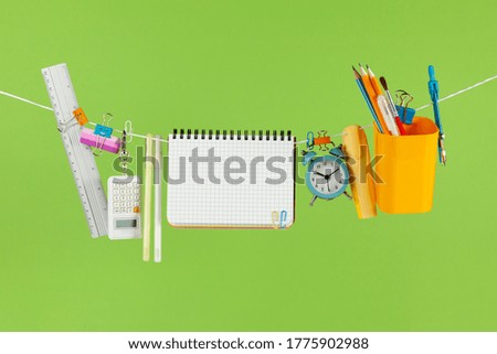 Sale of school supplies, on green background. Banner or flyer, overhead.