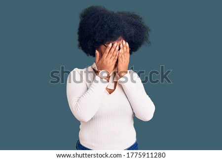 Young african american girl wearing casual clothes and glasses rubbing eyes for fatigue and headache, sleepy and tired expression. vision problem 