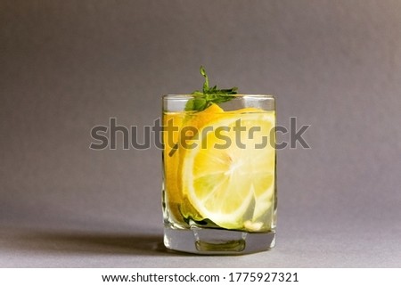 cold Water with fresh lemon and mint in a glass. High quality photo