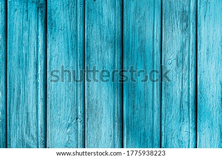 Natural background. Nature background. Peeling paint on an old wooden background. Wood texture. Blue background.