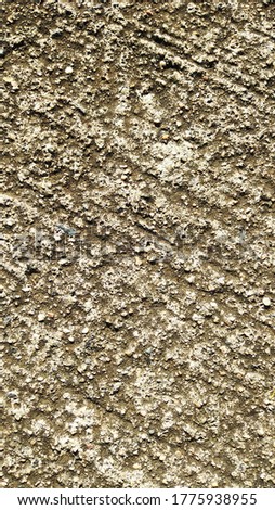 Sidewalk cement, worked with rough scratched non-slip lines, to be used as texture or wallpaper. Taken diagonally with a closeup plane shows a multitude of elements that combined generate many shapes.