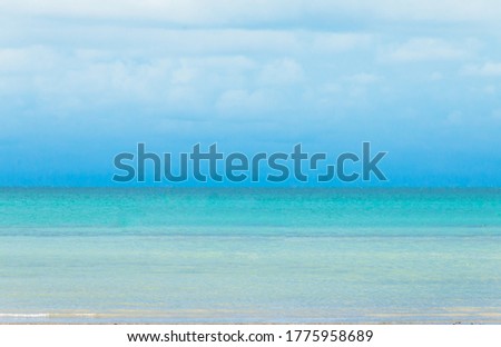 Blue sky and clouds on seascape,sea view on beach, soft focus of clouds on blue sea, Beautiful Landscape summer vertical front viewpoint tropical sea beach white sand clean and blue sky background.