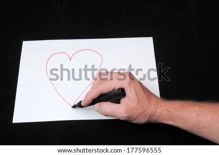 Caucasian Male Hand Drawing on a White Paper