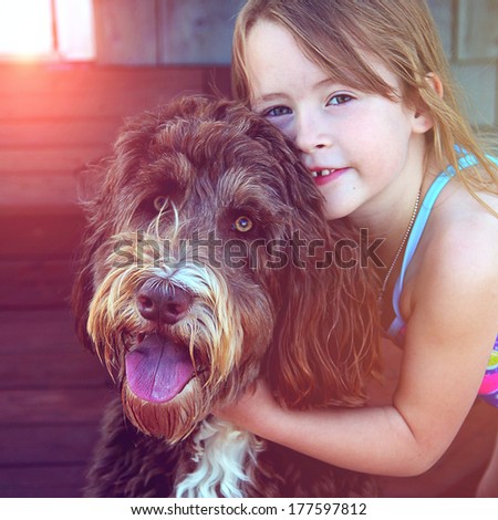 Little Girl with pet dog closeup - instagram effect